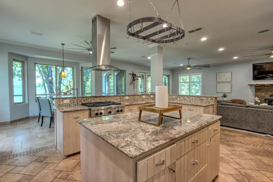 Granite kitchen island with the dining nook and living room beyond