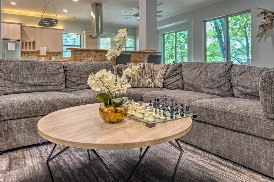 Large sectional sofa around a coffee table with a chess set